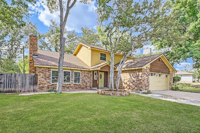 view of front of house with a front yard and a garage