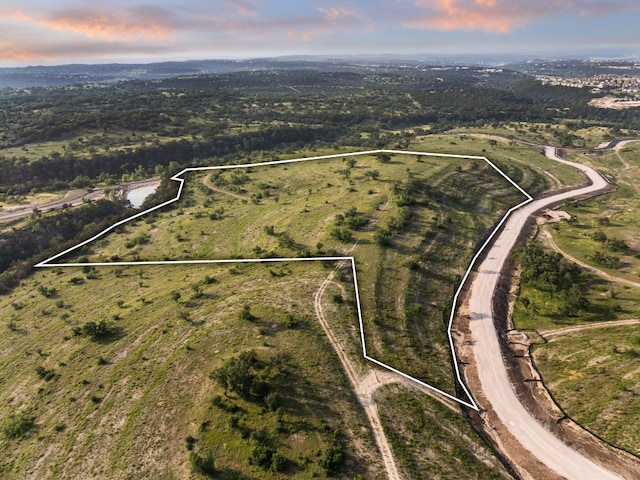 aerial view at dusk featuring a rural view