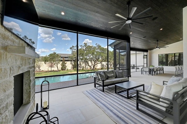 sunroom / solarium with ceiling fan