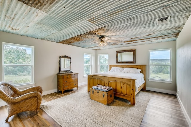 bedroom featuring ceiling fan and light hardwood / wood-style flooring