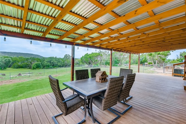 wooden terrace with a lawn