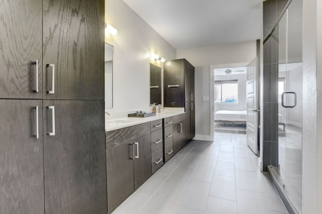 bathroom featuring tile patterned floors, ceiling fan, walk in shower, and vanity