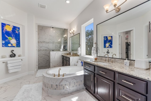 bathroom featuring vanity and separate shower and tub