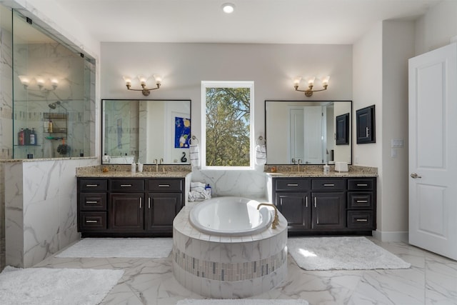 bathroom featuring vanity and a tub