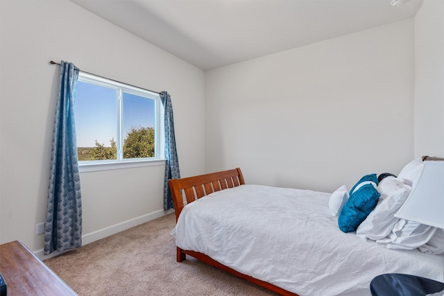 bedroom with light carpet