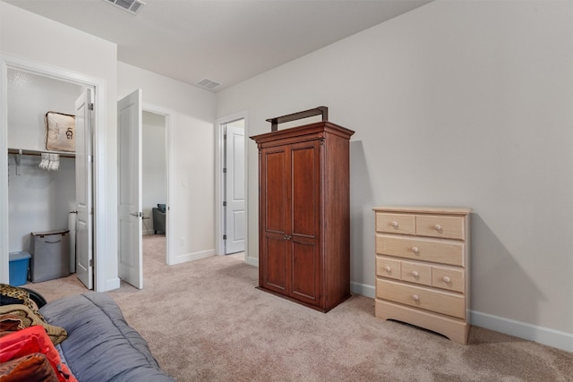 carpeted bedroom with a closet