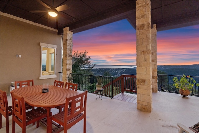 exterior space featuring ceiling fan and a mountain view