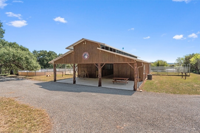 exterior space with central AC and an outdoor structure