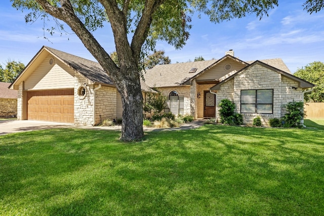 ranch-style house featuring a garage and a front lawn