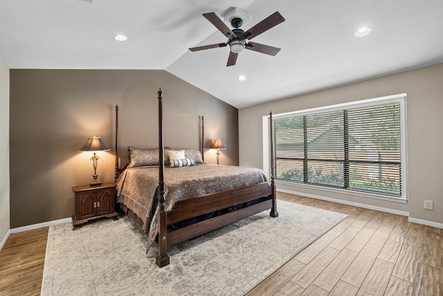 bedroom featuring vaulted ceiling, ceiling fan, and light hardwood / wood-style floors