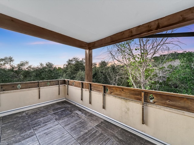 view of balcony at dusk