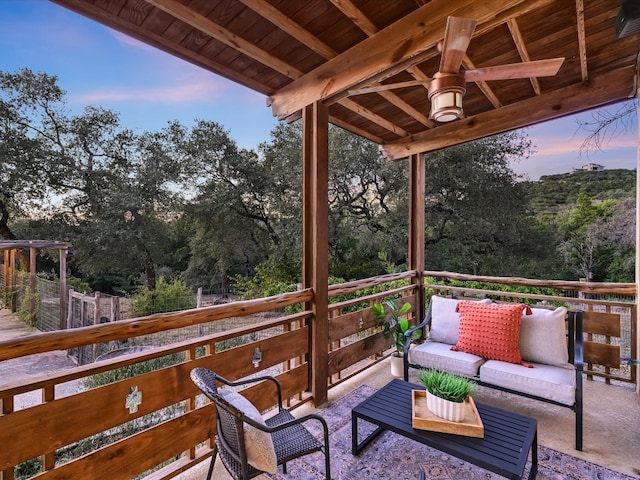 deck at dusk with outdoor lounge area