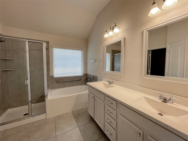 bathroom featuring tile patterned flooring, vanity, vaulted ceiling, and independent shower and bath