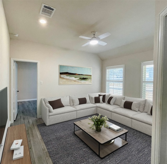 living room featuring hardwood / wood-style flooring, ceiling fan, and lofted ceiling