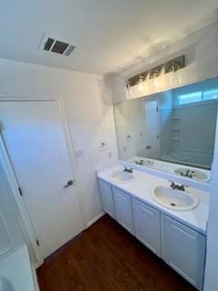 bathroom with wood-type flooring and vanity