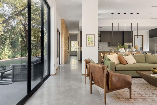 living room with plenty of natural light and sink