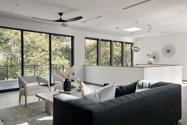 living room featuring ceiling fan and light wood-type flooring