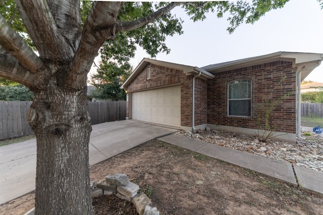 single story home featuring a garage