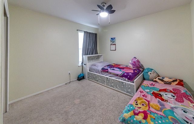 carpeted bedroom featuring ceiling fan