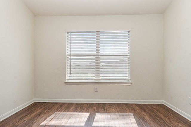 spare room featuring dark hardwood / wood-style floors