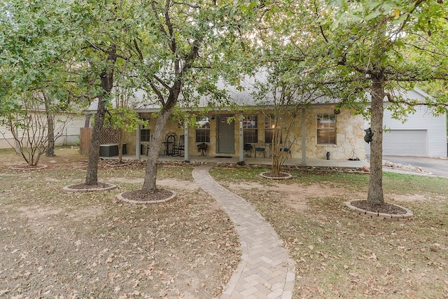 view of front facade with a porch and a garage