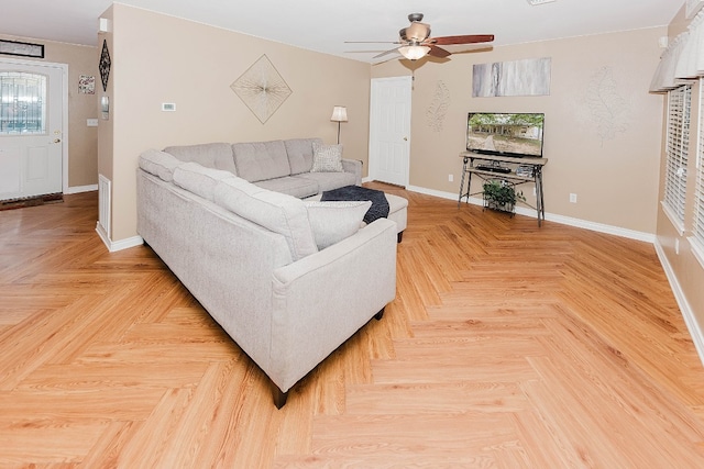 living room with parquet flooring and ceiling fan