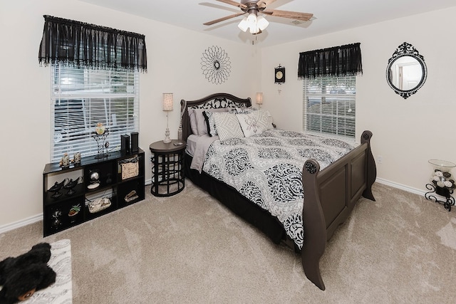 bedroom featuring ceiling fan and light colored carpet