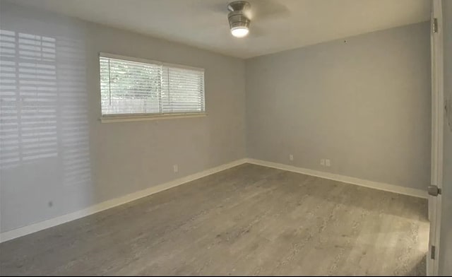 spare room with light hardwood / wood-style floors and ceiling fan