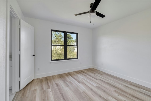 spare room with light wood-type flooring and ceiling fan