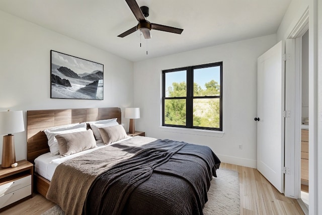 bedroom featuring ceiling fan and light hardwood / wood-style flooring