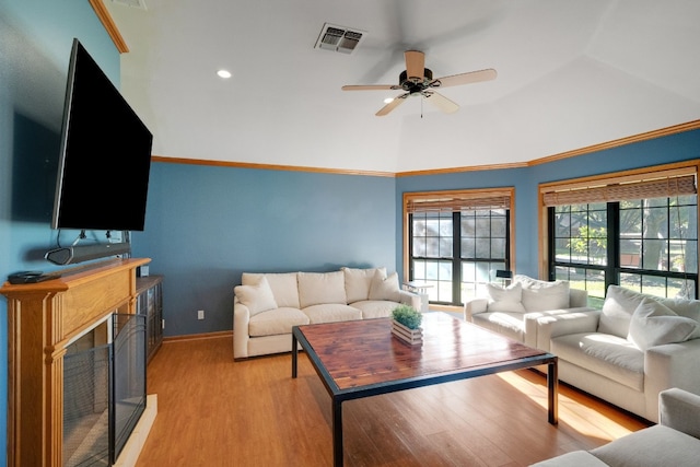 living room featuring light hardwood / wood-style floors and ceiling fan