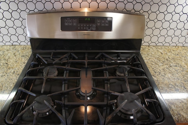 room details featuring stainless steel gas range oven