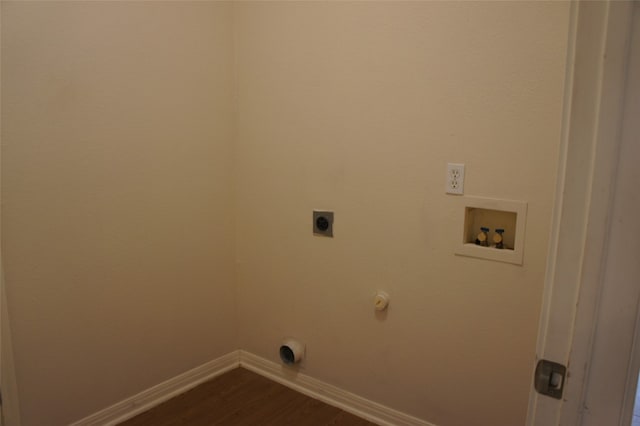 clothes washing area with hookup for a washing machine, gas dryer hookup, hardwood / wood-style floors, and hookup for an electric dryer