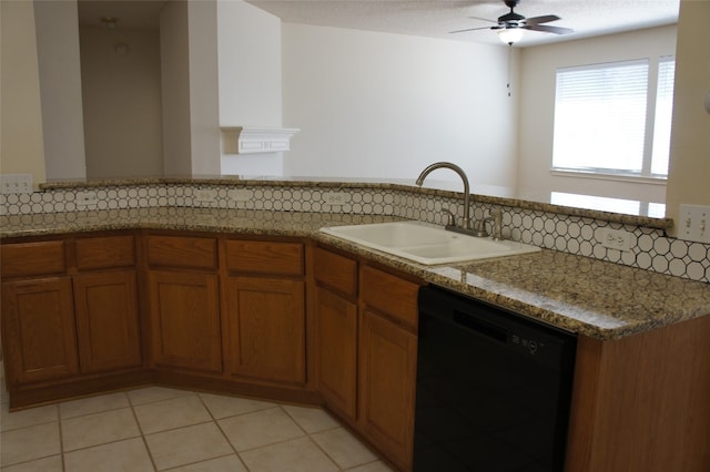 kitchen featuring dishwasher, tasteful backsplash, sink, kitchen peninsula, and light tile patterned floors