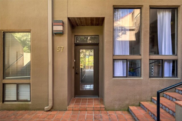 1707 Spyglass Dr Unit 57, Austin, TX 78746 - view of exterior entry featuring stucco siding