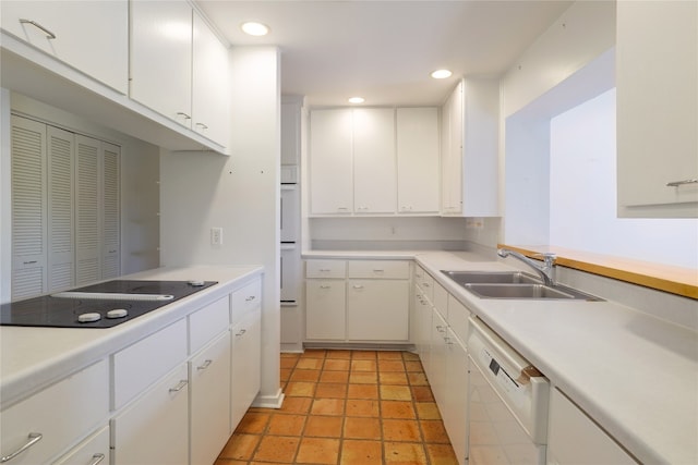 kitchen with white appliances and white cabinetry