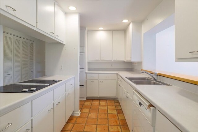 1707 Spyglass Dr Unit 57, Austin, TX 78746 - kitchen with dishwasher, a sink, black electric cooktop, light countertops, and recessed lighting
