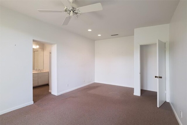 1707 Spyglass Dr Unit 57, Austin, TX 78746 - unfurnished bedroom with carpet, baseboards, recessed lighting, ensuite bath, and ceiling fan