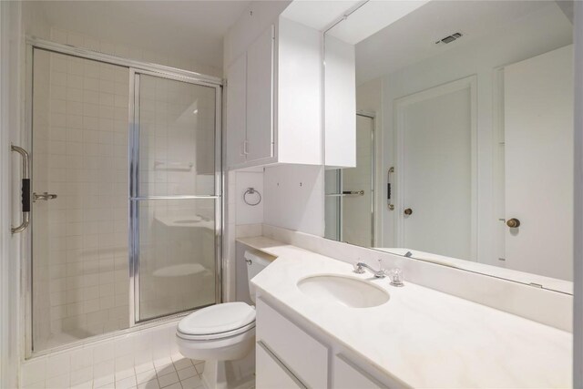 1707 Spyglass Dr Unit 57, Austin, TX 78746 - bathroom with vanity, a stall shower, toilet, and tile patterned flooring