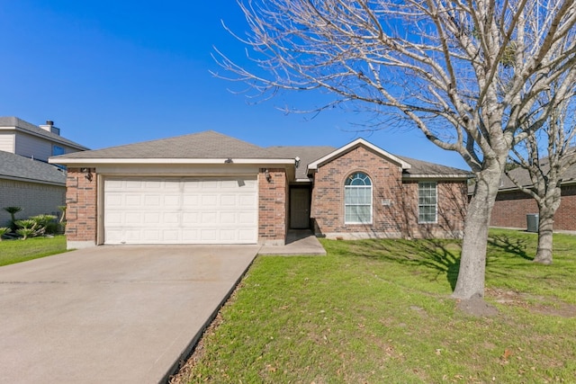 single story home featuring a front yard and a garage