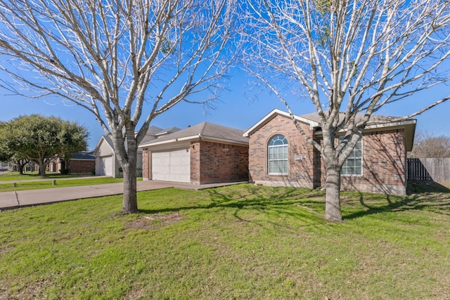 ranch-style house featuring a front yard and a garage