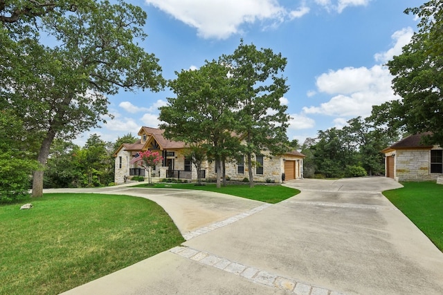 view of front of home featuring a garage and a front yard