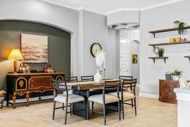 dining space with ornamental molding