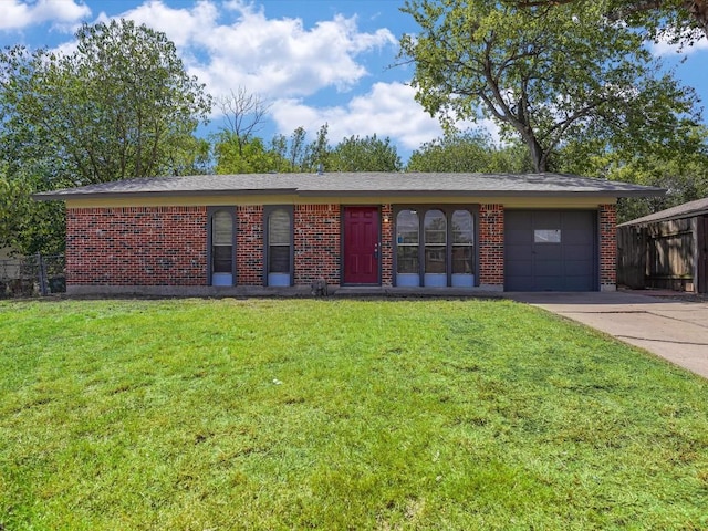 single story home featuring a front lawn and a garage