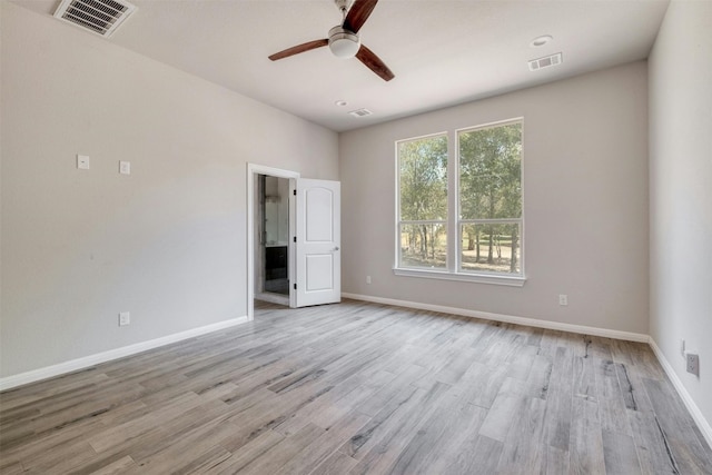 unfurnished room featuring ceiling fan and light hardwood / wood-style floors