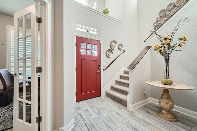 foyer entrance featuring light hardwood / wood-style flooring and plenty of natural light