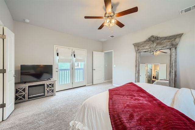 carpeted bedroom featuring ceiling fan and access to outside