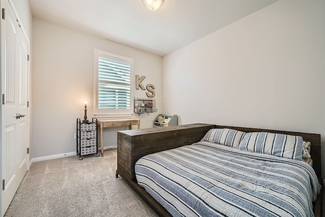 bedroom with light colored carpet