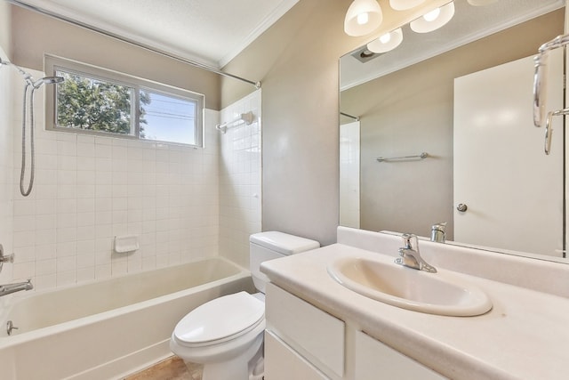 full bathroom featuring vanity, crown molding, tile patterned flooring, toilet, and tiled shower / bath