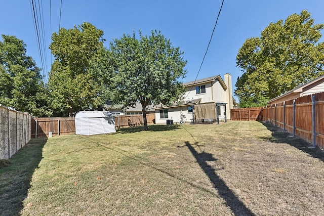 view of yard with a storage shed